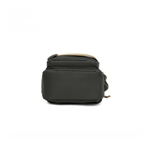 Detailed bottom view of water-resistant green oxford fabric chest bag with grid texture