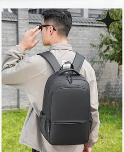 Outdoor shot of a black waterproof business laptop backpack with side storage pockets