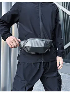 Detail of hardshell chest bag featuring carbon fiber texture and geometric cut design