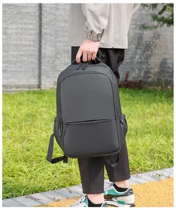 Water-repellent matte black men's backpack showing the thickened handle and side pocket