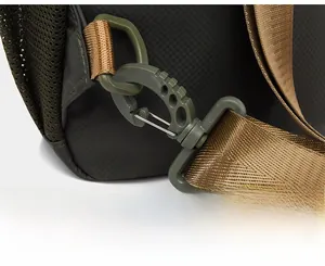 Detail of the detachable swivel hook and durable nylon strap on men's green shoulder bag