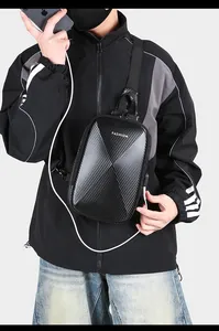 Close-up of black hard shell chest bag with USB charging port and carbon fiber texture