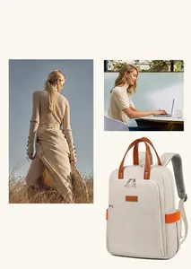 Detail view of cream business backpack with brown leather handles and breathable mesh straps