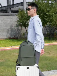 Deep olive green waterproof laptop backpack for men featuring side pockets and sleek matte finish