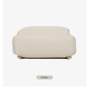 Detailed bottom view of minimalist beige nylon laptop backpack with reinforced base