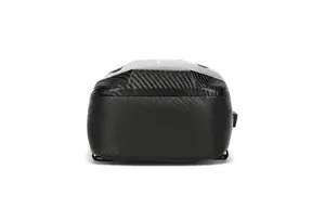 Detail of waterproof carbon fiber texture on the bottom of black crossbody chest bag