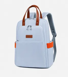 Side view of light blue laptop backpack with brown leather handle and mesh straps