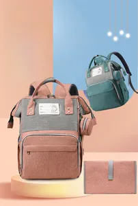Detail view of large capacity diaper bag set with name tag and folding changing mat