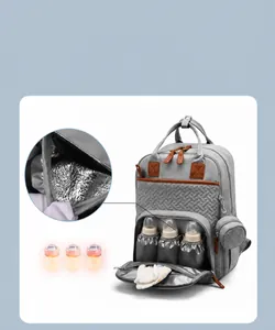 Detail of insulated aluminum foil bottle pockets in gray multifunctional diaper backpack