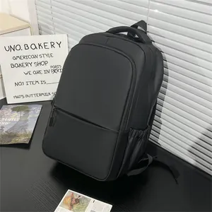 Close-up of matte black waterproof backpack with ergonomic straps and side pocket detail