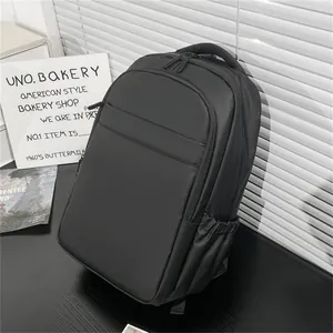 Macro side view of a minimalist black waterproof laptop backpack with side elastic pocket