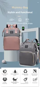 Detail view of pink and grey waterproof mummy bag with USB port and stroller hooks