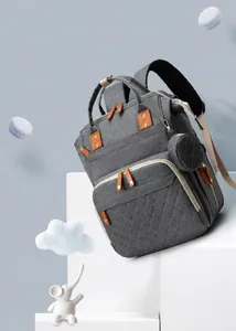 Close-up of grey multi-functional baby diaper backpack with quilted waterproof fabric