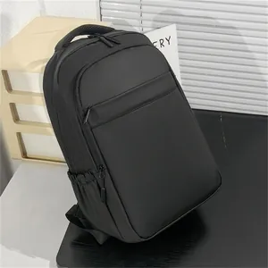 Close-up of waterproof synthetic fabric and hidden zipper pocket on black business backpack