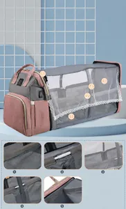 Detail view of portable crib backpack featuring breathable mesh sides and sunshade cover
