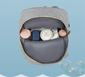 Top-down view of a spacious diaper bag interior with organized compartments for baby gear