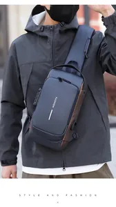 Detail view of navy blue crossbody bag featuring a TSA lock and integrated USB charging port