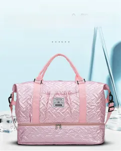Pink quilted travel bag featuring a separate bottom shoe compartment and waterproof material