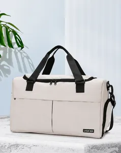 Detail of dry wet separation pocket and shoe compartment on beige travel duffel bag
