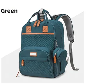 Detail of green multifunctional diaper backpack with woven texture and leather accents