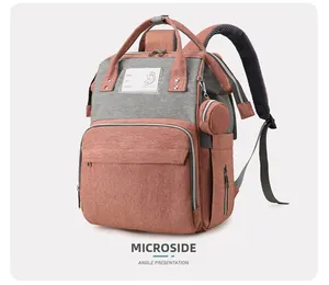 Detail view of pink and grey diaper backpack with large capacity and info tag