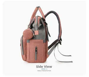 Side view of coral orange and gray multi-functional diaper backpack with mini round pouch