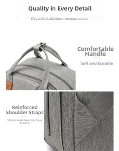 Detail of the reinforced shoulder straps and padded handle of the grey travel diaper bag