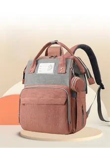 Pink and grey diaper backpack with large front pocket and breathable mesh shoulder straps