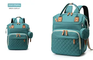 Detail view of large green multi-functional diaper backpack with side hanging pouch