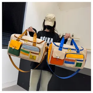 Detail view of large travel bags with functional pockets and vibrant color contrast design