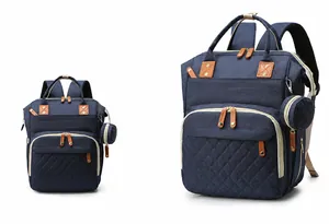 Detail view of large blue diaper backpack with insulated bottle pockets and small coin purse