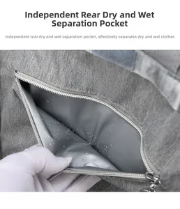 Detail of gray diaper bag featuring an independent rear waterproof wet dry separation pocket