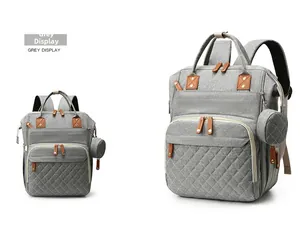 Front and side view of grey diaper backpack featuring quilted pocket and round pouch