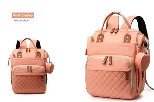 Pink multifunctional diaper backpack featuring quilted pattern and side coin purse