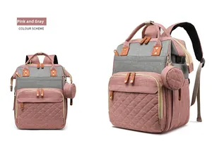 Pink and grey diaper backpack detail with diamond quilting and external USB charging port