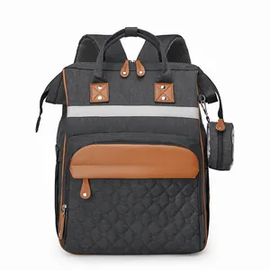 Large gray diaper backpack with brown leather details and stroller straps