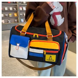 Detail of multi-pocket travel bag with colorful zippers and durable nylon material