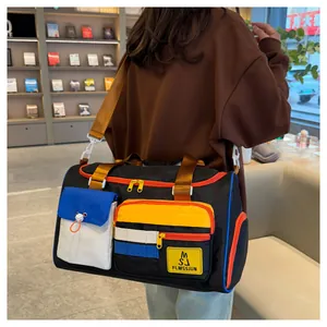 Close-up of contrast color travel bag with adjustable strap and waterproof nylon texture
