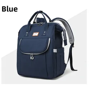 Deep blue multi-functional baby diaper backpack featuring wide opening and padded straps