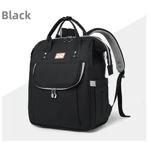 Detail of black diaper backpack showing front zipper pocket and breathable mesh straps