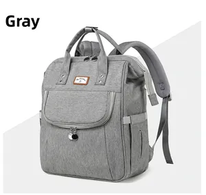 Detail view of a grey multi-functional diaper backpack with breathable honeycomb straps