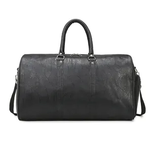 Large black travel gym bag with dry wet separation and embossed texture pattern