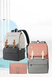 Detail view of large capacity diaper bag with portable folding changing mat and USB port