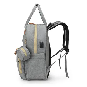 Grey large capacity multi-functional baby diaper backpack with USB port and small round pouch