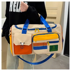 Detail of multi-color travel bag showing vibrant color-block design and waterproof fabric