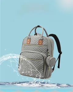 Waterproof grey backpack showing V-stitching detail and splash-resistant fabric