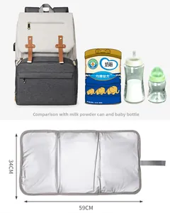 Detail view of large gray diaper bag capacity comparison and portable waterproof changing mat