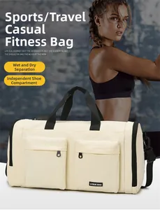 Close-up of cream travel bag featuring a dedicated shoe compartment and wet-dry separation