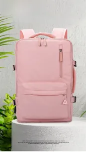 Detailed close-up of pink large capacity laptop backpack with side buckles and mesh straps