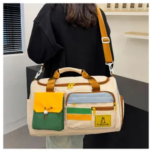 Detailed view of the large travel bag showing multi-color pockets and nylon texture